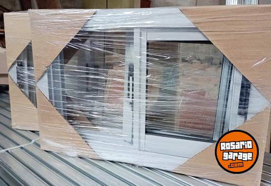 Hogar - Ventanas y ventiluces aluminio. Con rejas. - En Venta